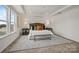 Bedroom with a white bed, carpet, and natural light at 5227 Hatcher Creek Rd # 43, Charlotte, NC 28215