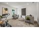 Cozy bonus room with neutral walls, carpet, and seating, plus exercise bike at 5227 Hatcher Creek Rd # 43, Charlotte, NC 28215