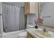 Functional bathroom with a shower-tub, vanity, toilet, neutral color scheme, and practical storage at 524 Damascus Church Rd, Statesville, NC 28625