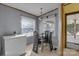 Well-lit dining area with a modern table set and a full-size chest freezer near the entrance at 524 Damascus Church Rd, Statesville, NC 28625
