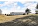 Spacious home with a long lawn on a sunny day and a blue sky with clouds at 524 Damascus Church Rd, Statesville, NC 28625