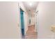 Hallway view with closet, lighting, and bathroom access at 5921 Amity Springs Dr, Charlotte, NC 28212