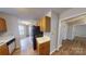 Traditional-style kitchen includes wood cabinetry and a black refrigerator at 5921 Amity Springs Dr, Charlotte, NC 28212