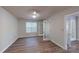 Open living space with double French doors and hardwood floors at 5921 Amity Springs Dr, Charlotte, NC 28212