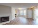 Bright living room with hardwood floors and a cozy fireplace at 5921 Amity Springs Dr, Charlotte, NC 28212