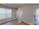 Bright living room featuring hardwood floors, French doors, and a neutral palette at 5921 Amity Springs Dr, Charlotte, NC 28212