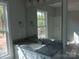 Well-lit bathroom vanity featuring granite countertop, a large mirror, and modern fixtures at 635 Acre Ct, York, SC 29745