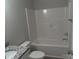 Bathroom with granite countertop vanity, white toilet, and white tub and shower combo at 635 Acre Ct, York, SC 29745