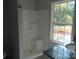 Bathroom featuring a walk-in shower, granite countertop, and a bright window at 635 Acre Ct, York, SC 29745