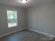Bedroom with a window offering natural light and neutral-colored walls at 635 Acre Ct, York, SC 29745