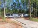 Charming single-story home with newly installed driveway, surrounded by mature trees at 635 Acre Ct, York, SC 29745