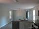 Sunlit kitchen with stainless appliances, white cabinetry, and an inviting breakfast bar at 635 Acre Ct, York, SC 29745