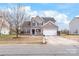 Charming two-story home with a brick and siding exterior, blue shutters, and well-manicured landscaping at 696 Yvonne Sw Dr, Concord, NC 28027