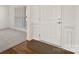 Home entrance with hardwood floors, white door, and trim work at 8025 Penman Springs Dr, Waxhaw, NC 28173