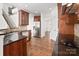Bright kitchen boasts stainless steel appliances, hardwood floors and granite countertops at 8025 Penman Springs Dr, Waxhaw, NC 28173