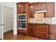 Kitchen features cherry cabinets, stainless steel appliances, granite countertops, and pantry at 8025 Penman Springs Dr, Waxhaw, NC 28173