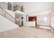 Open-concept living area featuring a staircase, kitchen with dark wood cabinets at 8025 Penman Springs Dr, Waxhaw, NC 28173