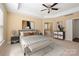 Spacious main bedroom with tray ceiling and ensuite bathroom at 8025 Penman Springs Dr, Waxhaw, NC 28173