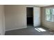 Bedroom showcasing ensuite bathroom and window for natural light at 811 Sanford St, Marshville, NC 28103
