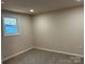 Neutral bedroom featuring carpeted floor and a window for natural light at 811 Sanford St, Marshville, NC 28103