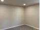Empty bedroom featuring neutral walls and carpeted floor at 811 Sanford St, Marshville, NC 28103