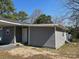 Gray house with a new door and windows, complemented by neutral landscaping at 811 Sanford St, Marshville, NC 28103