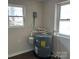 Utility room with a modern water heater positioned between two bright windows at 811 Sanford St, Marshville, NC 28103