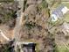 A bird's eye view of prime real estate, highlighting spacious lots and luxurious homes amidst a wooded landscape at 8328 Victoria Lake Dr, Waxhaw, NC 28173