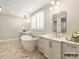 Elegant bathroom boasting a standalone tub, double vanities, stylish lighting, and modern fixtures at 8328 Victoria Lake Dr, Waxhaw, NC 28173