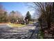 Elegant gated entrance with stone pillars and manicured landscaping, creating an inviting approach to the property at 8328 Victoria Lake Dr, Waxhaw, NC 28173