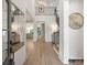Bright entryway with hardwood floors, high ceilings, and iron-railed staircase to second floor at 8328 Victoria Lake Dr, Waxhaw, NC 28173