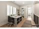 Bright office space featuring a desk, shelves, and large windows with shutters at 8328 Victoria Lake Dr, Waxhaw, NC 28173