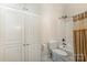 Bright bathroom features built in cabinets, toilet and bath/shower combination at 9423 Belmont Ln, Marvin, NC 28173