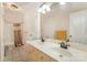 Bathroom featuring double sinks, tile flooring, and a shower-tub combo at 9423 Belmont Ln, Marvin, NC 28173