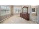 Bright bedroom with a large window and neutral carpet, providing a comfortable space at 9423 Belmont Ln, Marvin, NC 28173