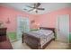 Bright bedroom featuring a ceiling fan, window and warm, inviting decor at 9423 Belmont Ln, Marvin, NC 28173