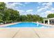 Large community pool with plenty of lounge chairs and a covered seating area for residents at 9423 Belmont Ln, Marvin, NC 28173