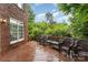 A spacious wooden deck is furnished with wicker seating for relaxing outdoors at 9423 Belmont Ln, Marvin, NC 28173