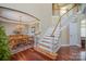 Elegant foyer with hardwood floors, a staircase, and dining room access, creating a welcoming ambiance at 9423 Belmont Ln, Marvin, NC 28173