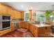 Well-equipped kitchen featuring stainless appliances, wood cabinets, and granite countertops at 9423 Belmont Ln, Marvin, NC 28173