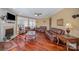 Spacious living room showcasing hardwood floors and an elegant fireplace at 9423 Belmont Ln, Marvin, NC 28173