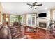 Inviting living room with hardwood floors, fireplace, and abundant natural light at 9423 Belmont Ln, Marvin, NC 28173