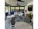 Comfortable outdoor patio area featuring stylish seating, tables, ceiling fans, and a television for entertainment at 9423 Belmont Ln, Marvin, NC 28173