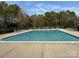 Inviting swimming pool with ample lounge chairs for relaxing on the sundeck, perfect for enjoying sunny days at 9423 Belmont Ln, Marvin, NC 28173