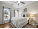 Bright bedroom features natural light, ceiling fan, and neutral decor, creating a calming retreat at 9627 Baileywick Rd, Charlotte, NC 28277
