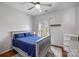 Cozy bedroom with blue bedding, plush pillows, a ceiling fan, and carpet flooring at 9627 Baileywick Rd, Charlotte, NC 28277