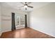 Cozy bedroom features hardwood floors, natural light from the windows, and ample space for customization at 9627 Baileywick Rd, Charlotte, NC 28277