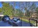 Inviting outdoor deck area with comfortable wicker seating, perfect for relaxing and enjoying the surrounding scenery at 9627 Baileywick Rd, Charlotte, NC 28277