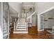 Bright foyer with hardwood floors, staircase and high ceilings, creating a grand entrance at 9627 Baileywick Rd, Charlotte, NC 28277