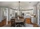 Spacious kitchen with ample counter space, an island, and views into an informal dining area at 9627 Baileywick Rd, Charlotte, NC 28277